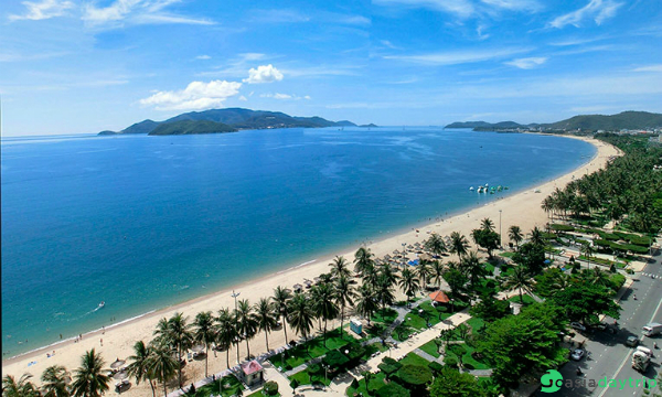 Nha Trang has long beach with white sand and blue water.